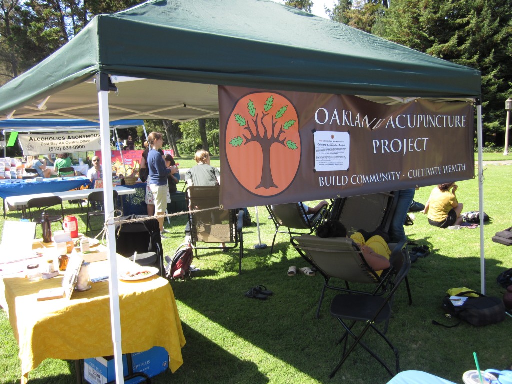Oakland Acupuncture Project's booth at Mills